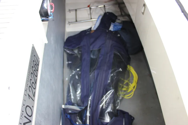 Slide: The Image of Storage compartment of a 2006 Fairline Phantom boat with equipment and gear. - 32