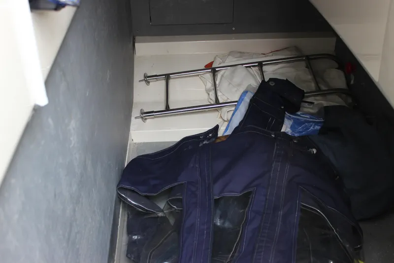 Slide: The Image of Storage compartment in a 2006 Fairline Phantom boat with miscellaneous items. - 34