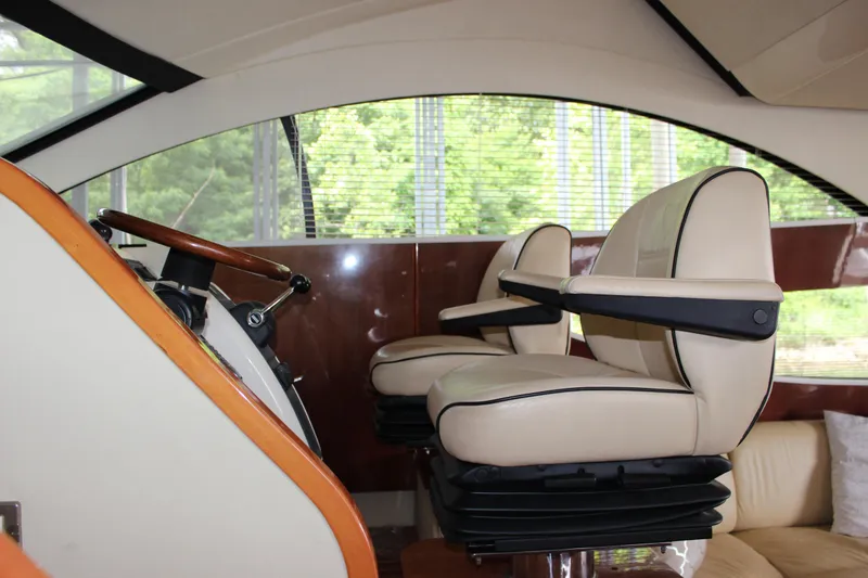 Slide: The Image of Interior helm of 2006 Fairline Phantom yacht with leather captain chairs. - 35