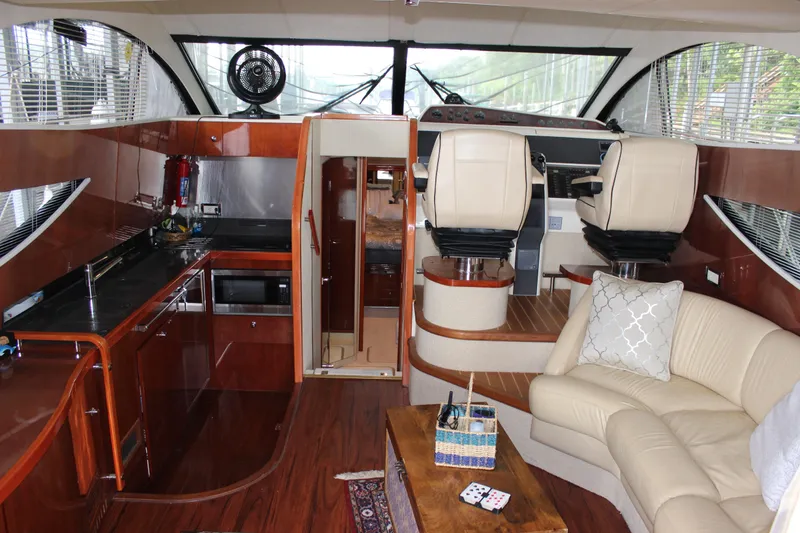 Slide: The Image of Interior of 2006 Fairline Phantom yacht with modern kitchen and cozy seating area. - 36
