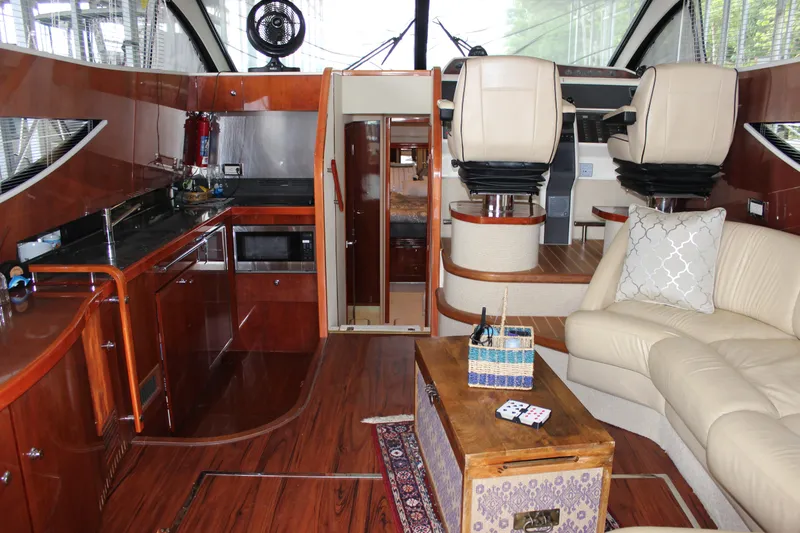 Slide: The Image of Luxurious interior of a 2006 Fairline Phantom yacht with modern kitchen and seating area. - 37