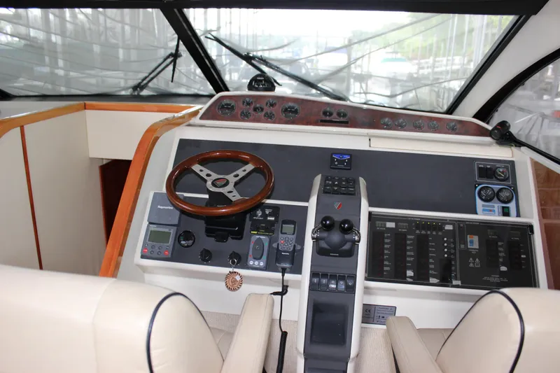 Slide: The Image of Fairline Phantom 2006 yacht helm with steering wheel and control panel. - 41