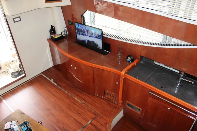 Slide: The Image of Interior of 2006 Fairline Phantom yacht with wooden cabinetry and modern amenities. - 44