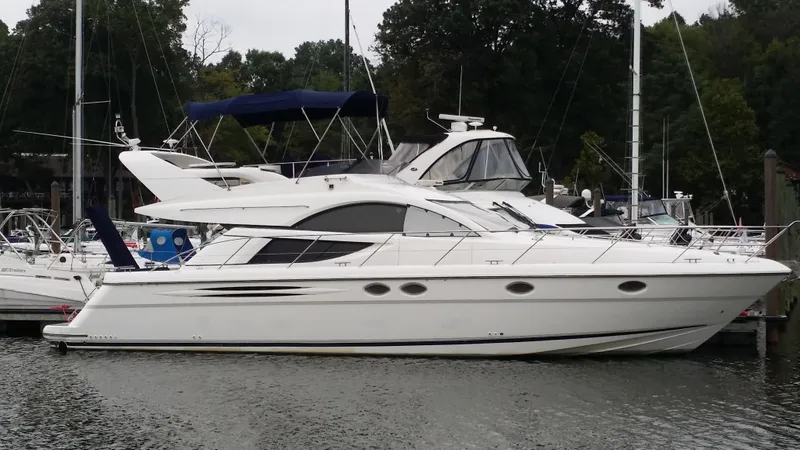 Slide: The Image of 2006 Fairline Phantom yacht docked in a marina. - 5