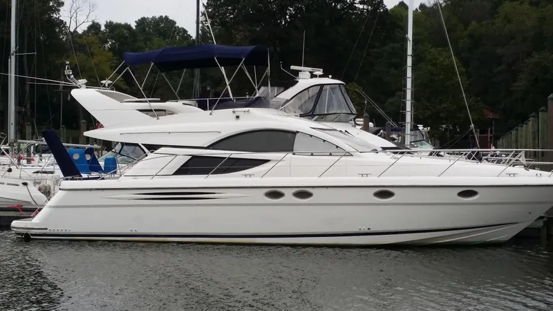 Slide: The Image of 2006 Fairline Phantom yacht docked at marina. - 6