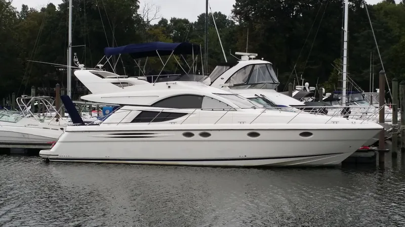 Slide: The Image of 2006 Fairline Phantom yacht docked at a marina. - 7