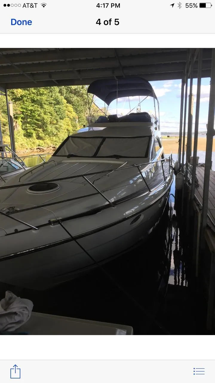 Slide: The Image of 2006 Fairline Phantom yacht docked in a covered marina. - 9