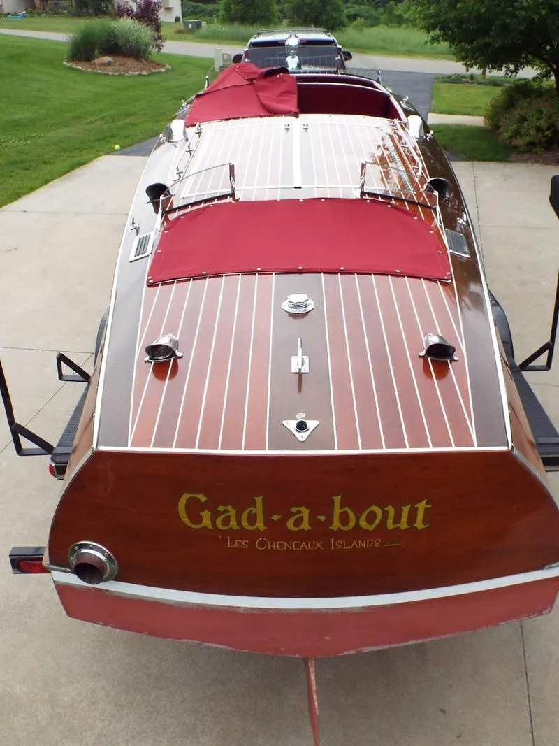 Slide: The Image of 1928 Hacker-Craft Dolphin boat with red covers and "Gad-a-bout" lettering on the stern. - 6