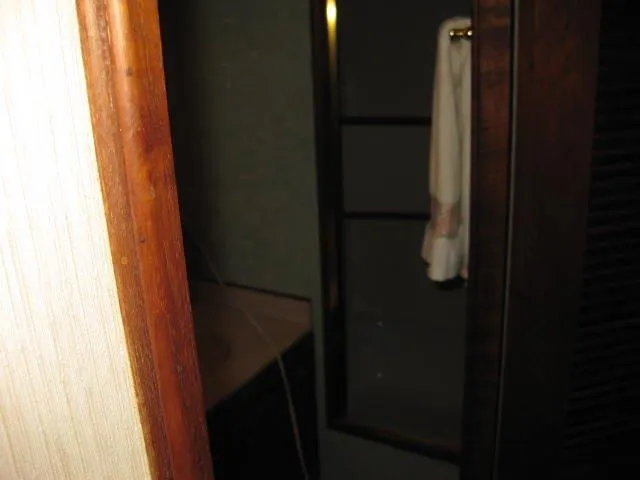Slide: The Image of 1984 Chris-Craft Constellation interior with wooden trim and towel rack. - 14