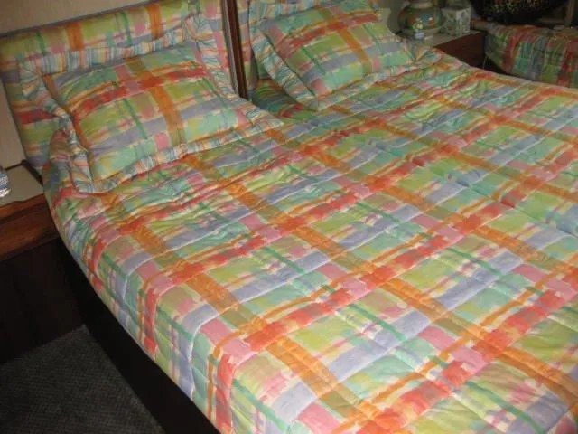 Slide: The Image of Colorful plaid bedding on a Chris-Craft Constellation 1984 boat bed. - 15