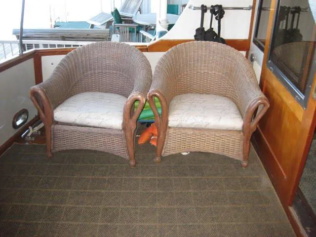 Slide: The Image of Two wicker chairs on 1984 Chris-Craft Constellation boat deck. - 31