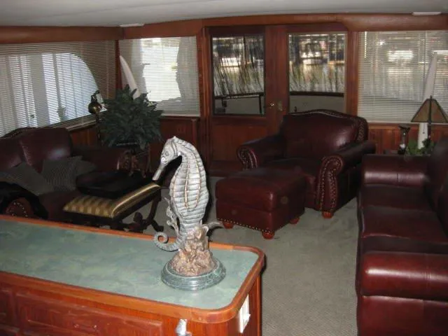 Slide: The Image of Luxurious 1984 Chris-Craft Constellation yacht interior with leather seating and seahorse decor. - 36