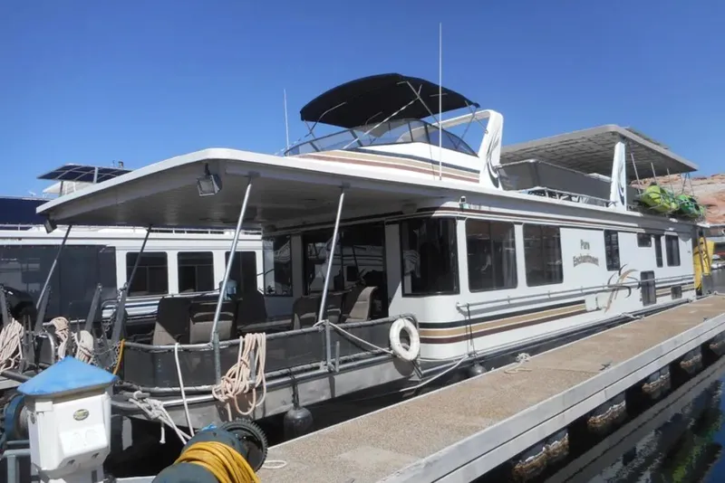 Slide: The Image of 2000 Stardust Cruisers Pure Enchantment Trip 24 & 34 houseboat docked at marina. - 2