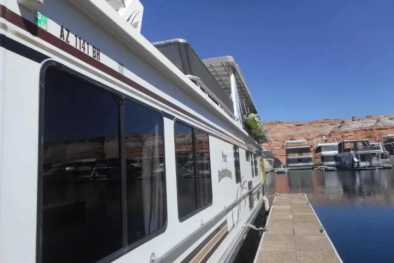 Slide: The Image of Houseboat docked at marina, Stardust Cruisers Pure Enchantment Trip 24 & 34, 2000 model. - 3