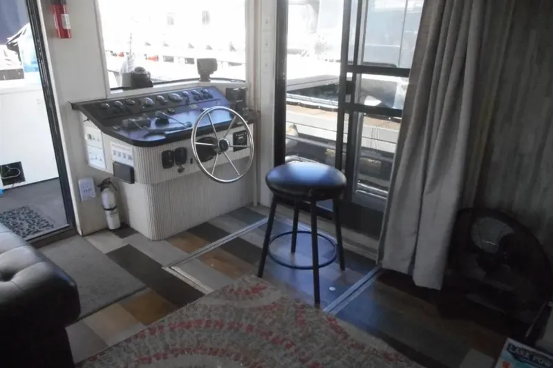 Slide: The Image of Helm area of 2000 Stardust Cruisers Pure Enchantment Trip, featuring steering wheel and stool. - 4