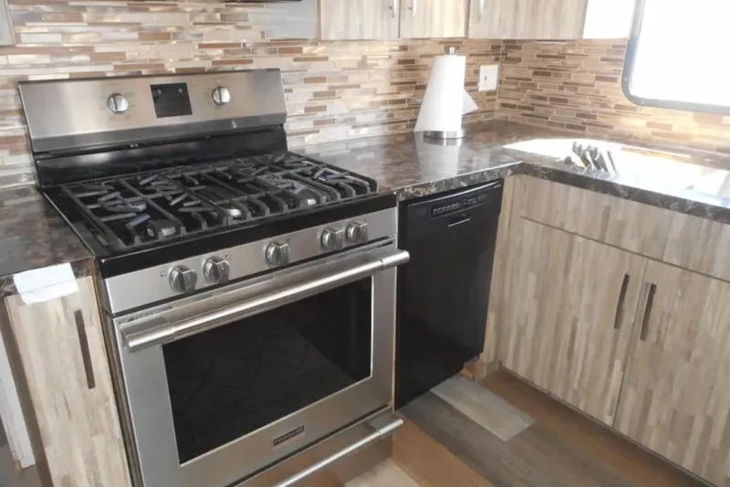 Slide: The Image of Modern kitchen in 2000 Stardust Cruisers Pure Enchantment Trip, featuring stainless steel appliances. - 6