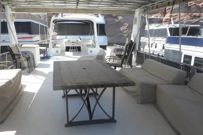 Slide: The Image of Spacious deck of 2000 Stardust Cruisers Pure Enchantment Trip, featuring seating and table. - 8