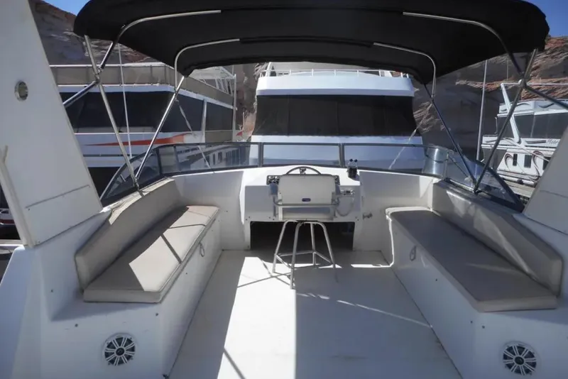 Slide: The Image of Open deck of 2000 Stardust Cruisers Pure Enchantment Trip, featuring seating and steering area. - 9