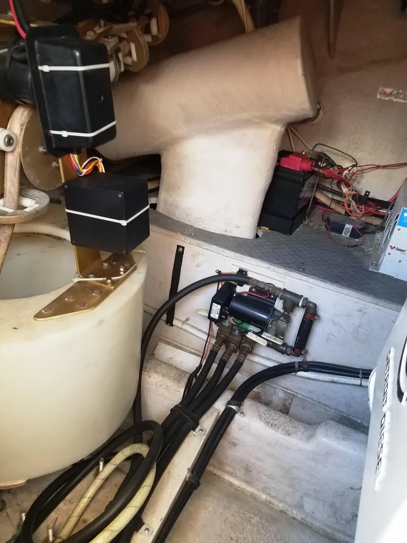 Slide: The Image of Engine compartment of a 1996 Sea Ray 500 Sundancer with visible wiring and components. - 20