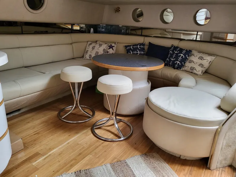 Slide: The Image of Luxurious interior of a 1996 Sea Ray 500 Sundancer yacht with elegant seating and decor. - 29
