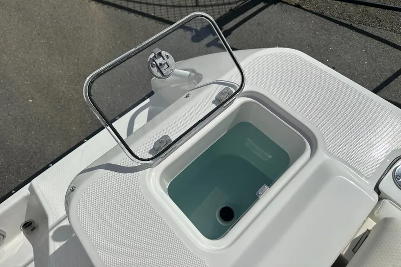 Slide: The Image of 2025 Edgewater 248CX Crossover boat with foldable rear seat and modern design. - 11