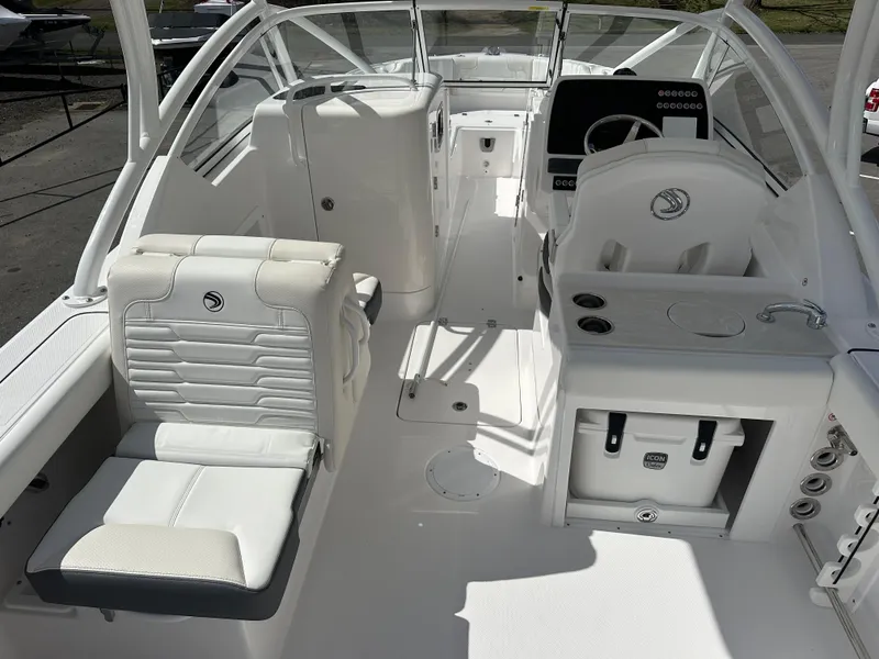 Slide: The Image of 2025 Edgewater 248CX Crossover boat livewell with open lid, showcasing interior. - 12