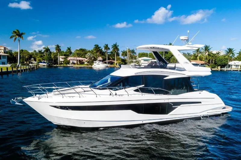 Slide: The Image of 2023 Galeon 500 Fly yacht cruising on a sunny day. - 14
