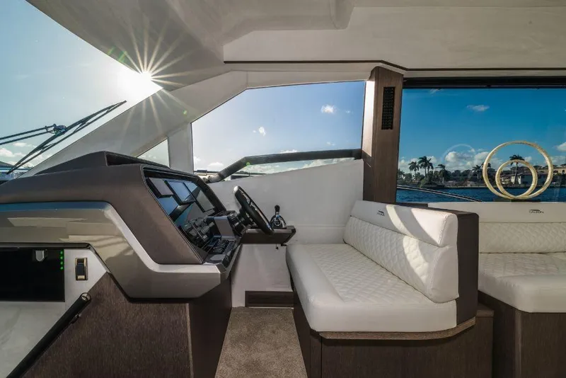 Slide: The Image of Interior of 2023 Galeon 500 Fly yacht with modern helm and seating. - 22