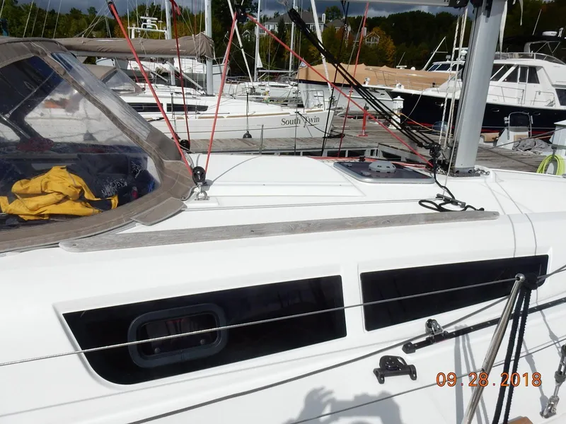 Slide: The Image of 2013 Jeanneau Sun Odyssey 33i sailboat deck with rigging and cockpit details. - 10