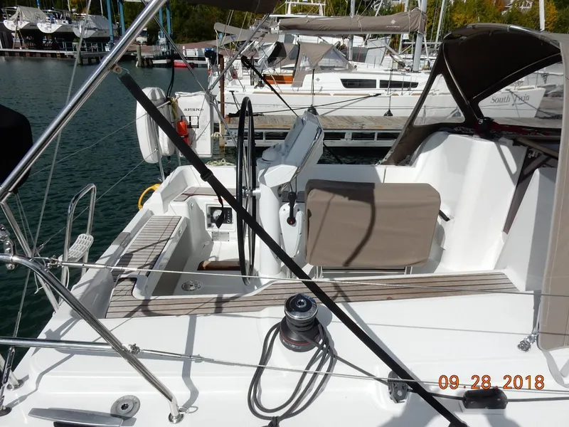 Slide: The Image of Jeanneau Sun Odyssey 33i sailboat cockpit, 2013 model, docked at marina. - 13