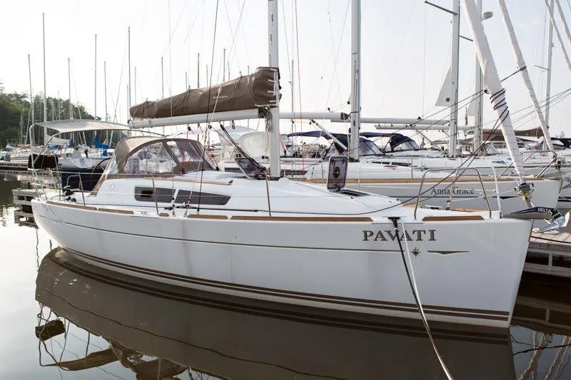 Slide: The Image of 2013 Jeanneau Sun Odyssey 33i sailboat docked in a marina. - 5