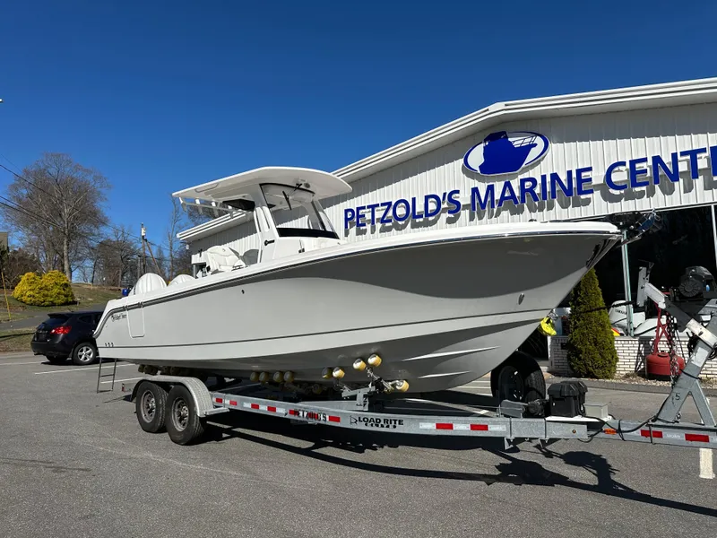 Slide: The Image of 2025 Edgewater 262 Center Console boat on trailer at Petzold's Marine Center. - 1