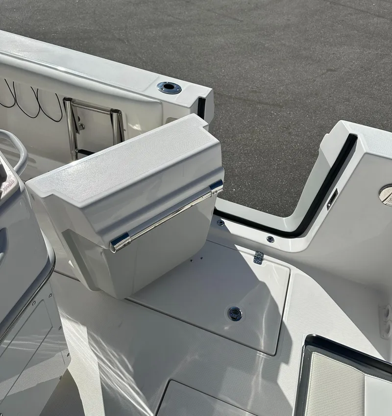 Slide: The Image of 2025 Edgewater 262 Center Console boat interior with seating and storage features. - 13