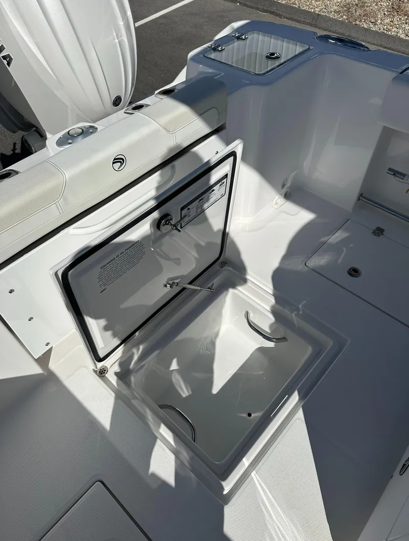 Slide: The Image of 2025 Edgewater 262 Center Console boat interior with open storage compartment. - 16