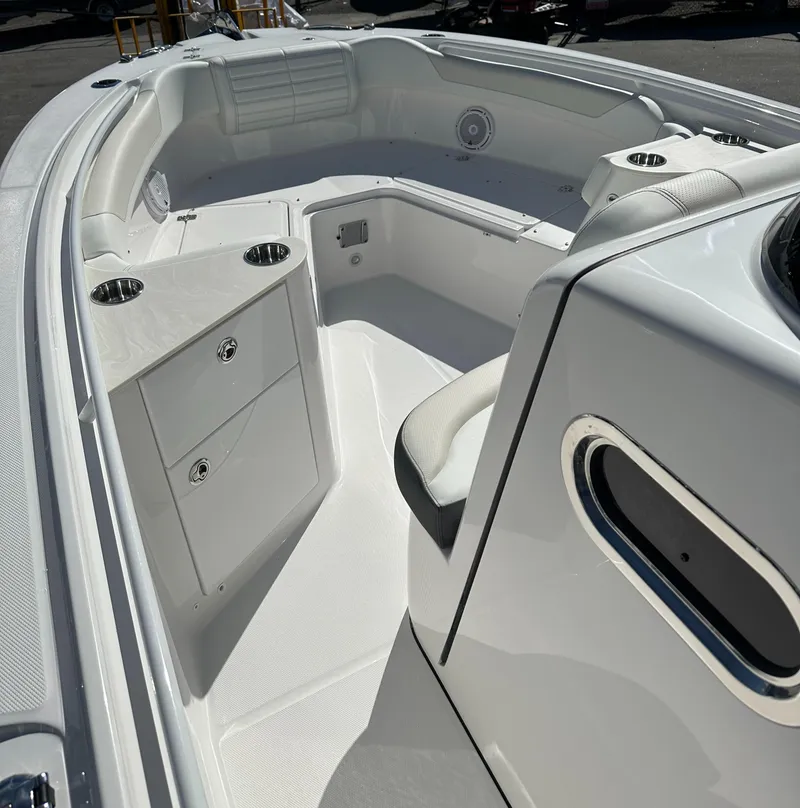 Slide: The Image of 2025 Edgewater 262 Center Console boat interior with seating and storage compartments. - 29