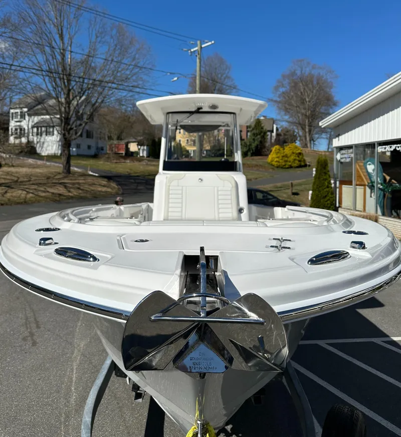 Slide: The Image of 2025 Edgewater 262 Center Console boat with sleek design, parked outdoors on a sunny day. - 3