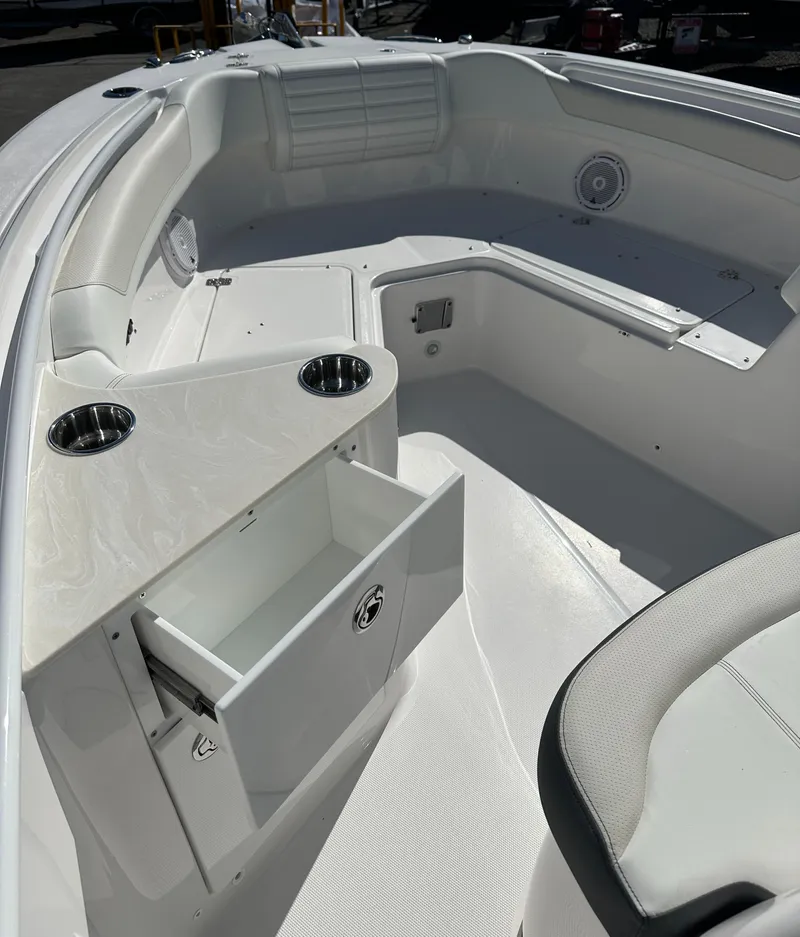 Slide: The Image of 2025 Edgewater 262 Center Console boat interior with seating and storage compartments. - 30