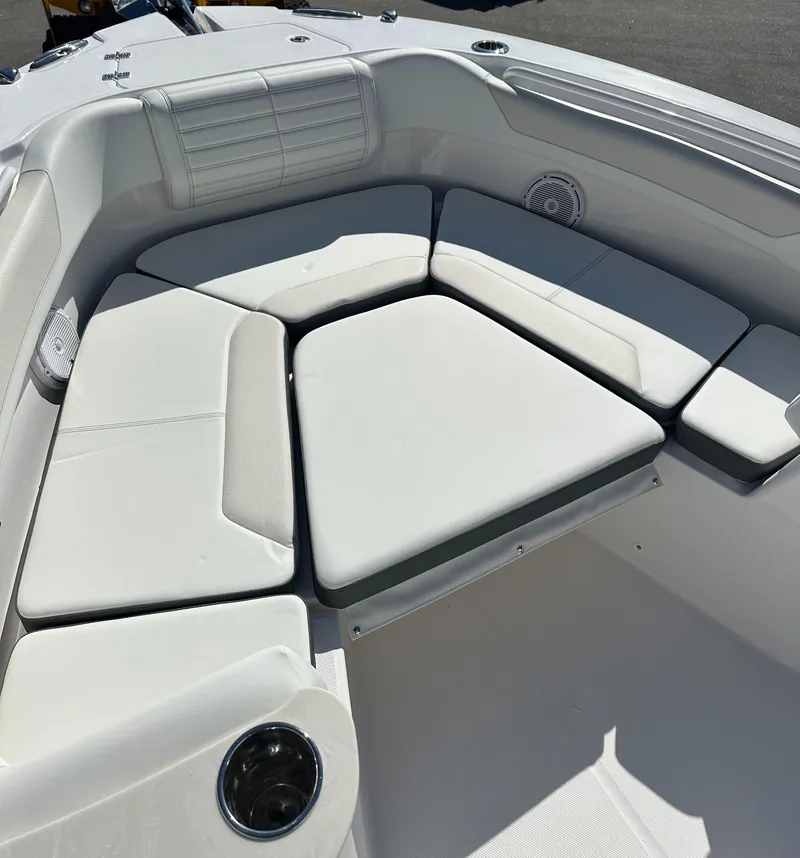 Slide: The Image of 2025 Edgewater 262 Center Console boat with cushioned seating area. - 32