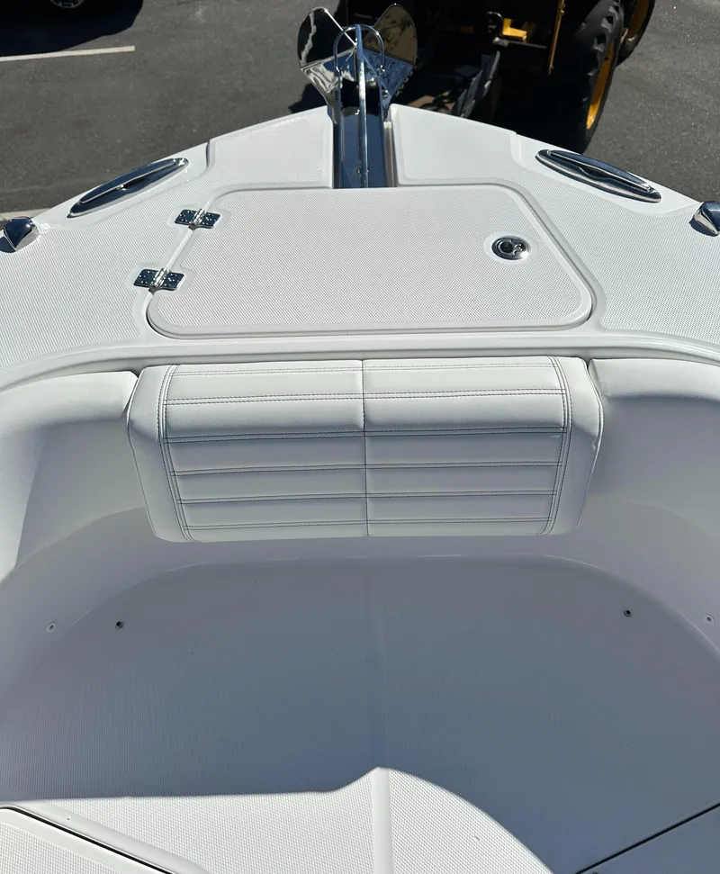 Slide: The Image of 2025 Edgewater 262 Center Console boat, featuring sleek white seating and storage compartment. - 36
