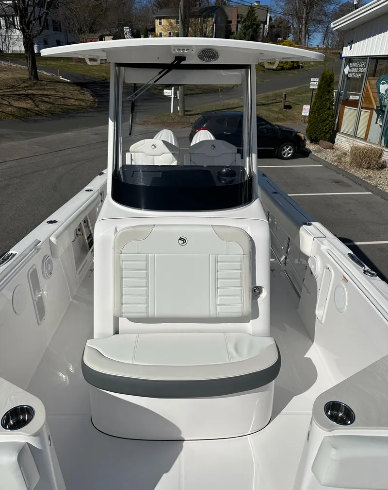 Slide: The Image of 2025 Edgewater 262 Center Console boat with sleek white seating and modern design. - 38