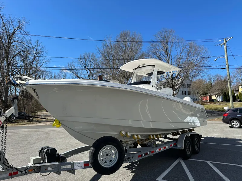 Slide: The Image of 2025 Edgewater 262 Center Console boat on trailer in parking lot. - 4