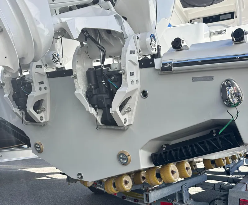 Slide: The Image of 2025 Edgewater 262 Center Console boat with dual outboard motors on a trailer. - 42