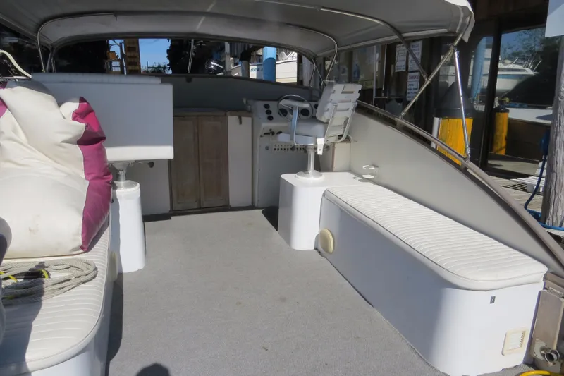 Slide: The Image of 1953 Rybovich Express boat interior with seating and helm station. - 13