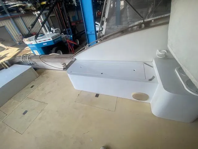 Slide: The Image of 1953 Rybovich Express boat interior with seating and storage in a workshop setting. - 30