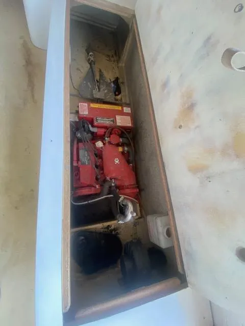 Slide: The Image of 1953 Rybovich Express engine compartment with visible red engine components. - 32