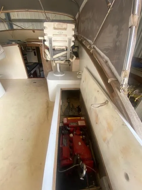 Slide: The Image of 1953 Rybovich Express boat interior with engine compartment and seating. - 33