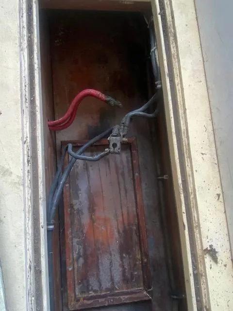 Slide: The Image of Old electrical panel with exposed wires in a 1953 Rybovich Express boat. - 42