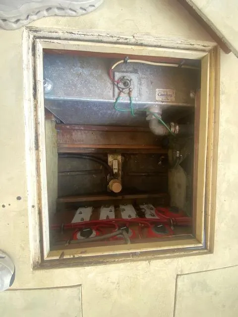 Slide: The Image of 1953 Rybovich Express engine compartment with visible wiring and components. - 45