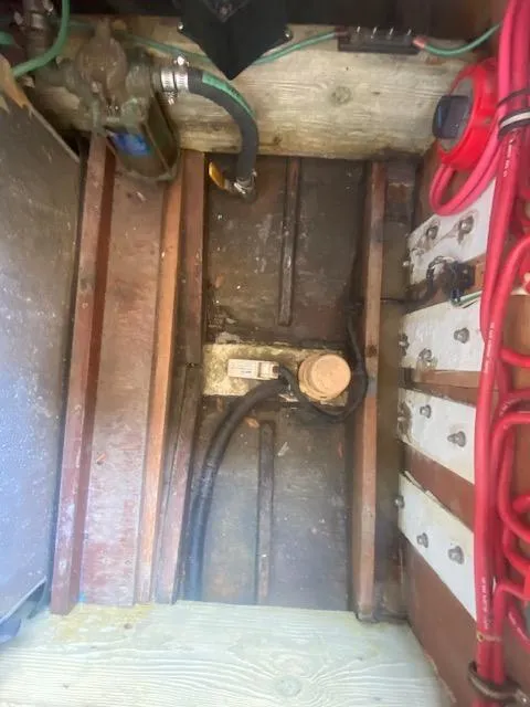 Slide: The Image of 1953 Rybovich Express boat interior showing engine compartment details. - 46