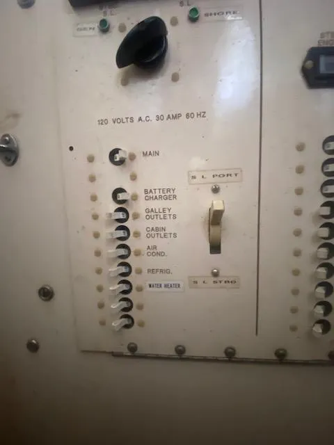 Slide: The Image of An electrical panel with switches for battery, galley, cabin, and air conditioning. - 50